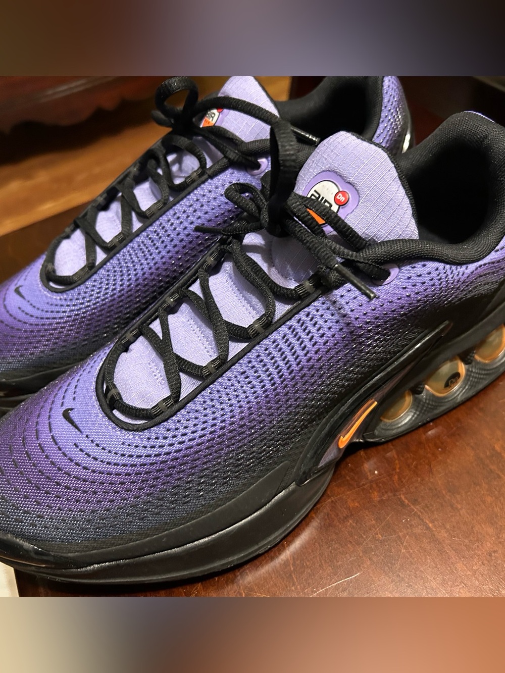 Nike Men’s size 14 Violet Air Max DN with Orange Swoosh.
